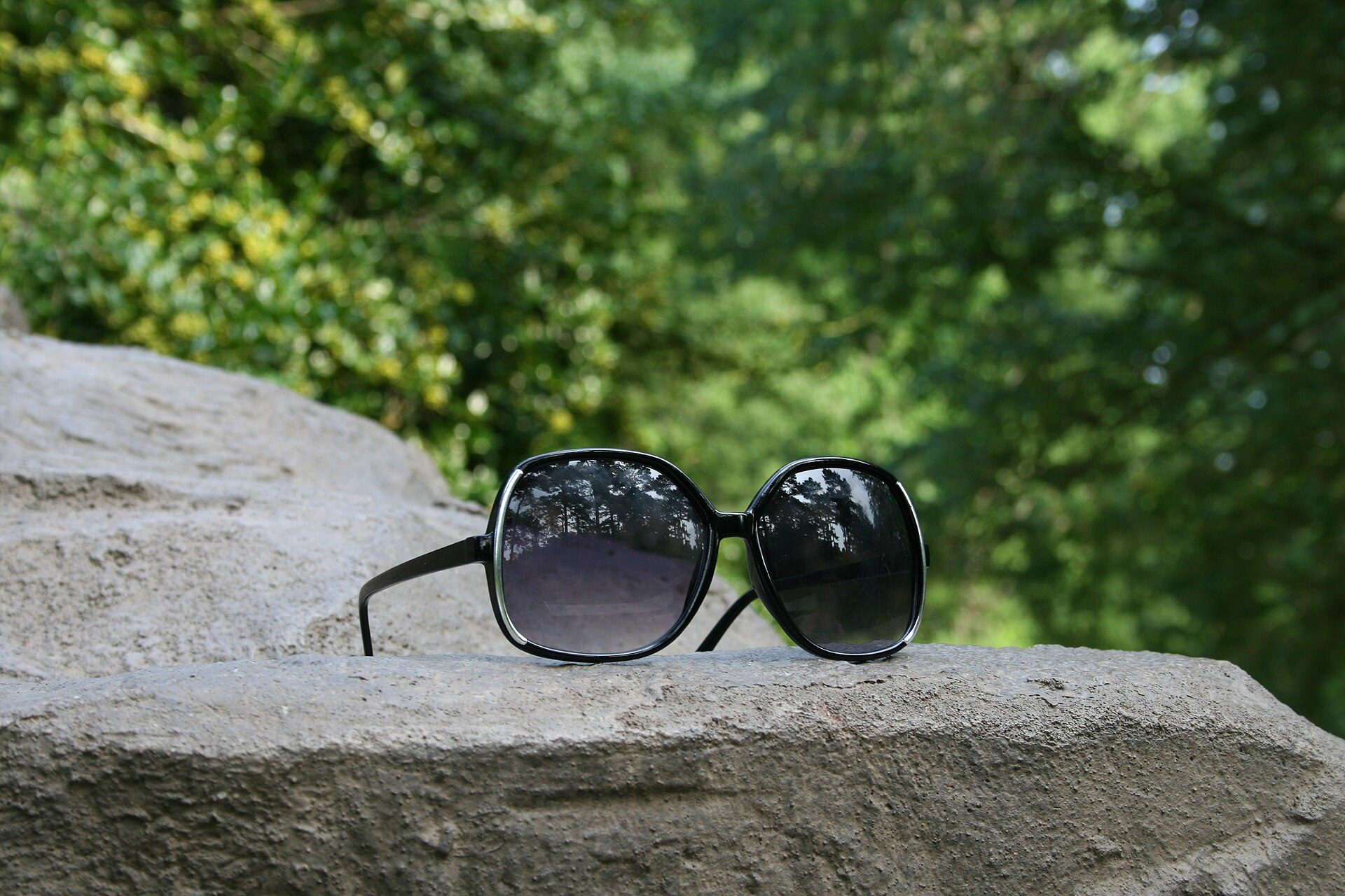 Oversized sunglasses on a rock