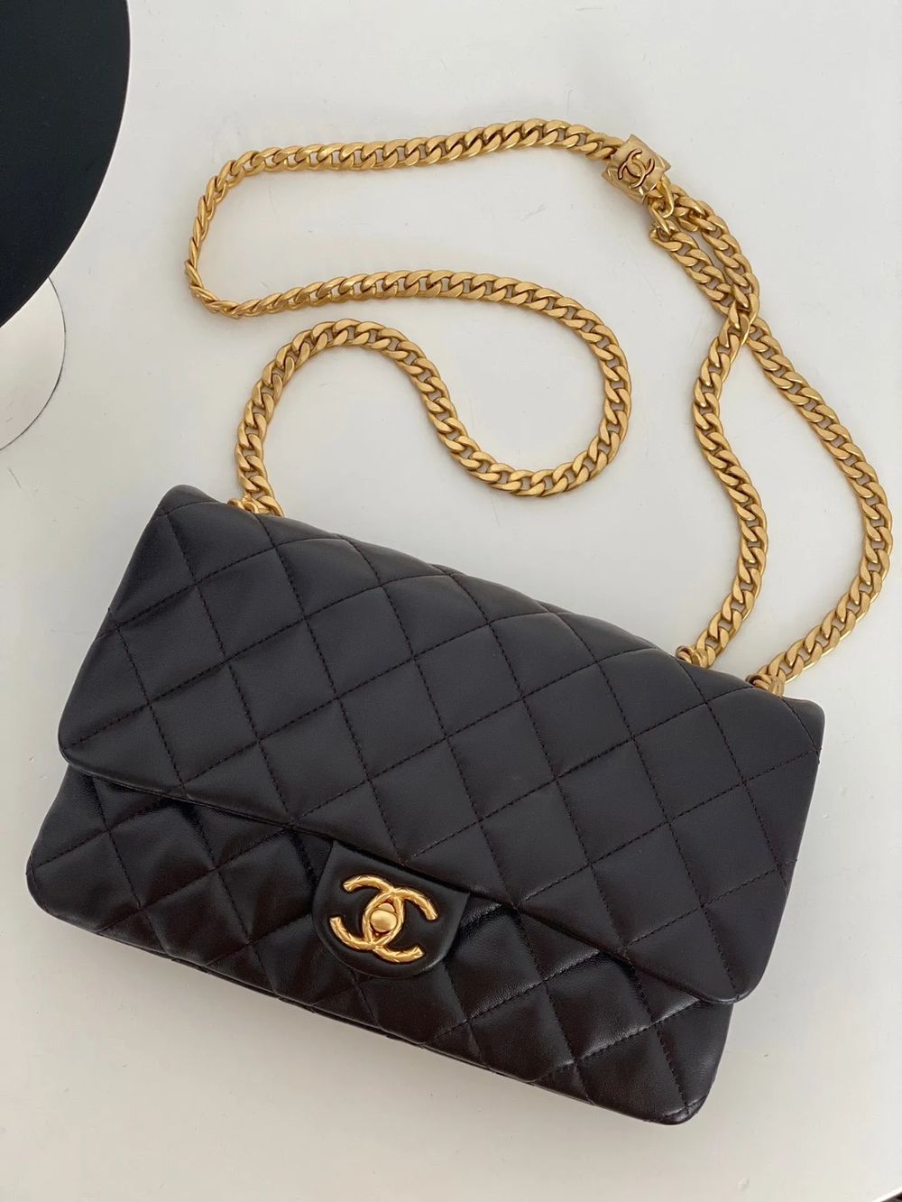 Chanel quilted flap bag in black leather with gold chain strap