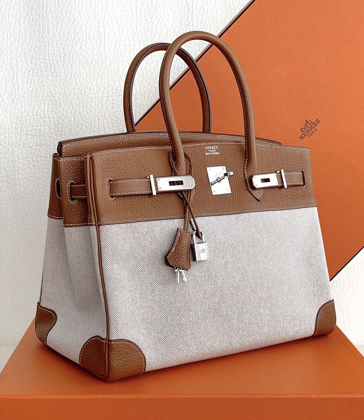 Hermès Birkin bag in leather and toile with an orange Hermès box