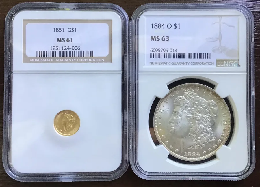 NGC certified coins side by side — an 1851 gold dollar graded MS 61 next to an 1884-O Morgan dollar, the kind of slabs LBC Pawn buys in Boston