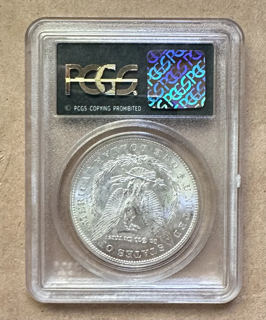 PCGS slab security hologram — the certification label checked in front of you when you sell a graded coin in Boston