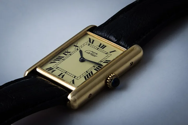 Cartier Tank in gold with Roman numerals — we buy Cartier watches in Boston