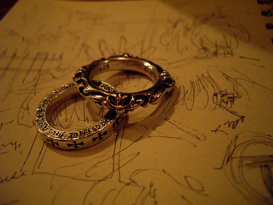 Chrome Hearts sterling silver rings with cross and fleur motifs — we buy Chrome Hearts jewelry in Boston