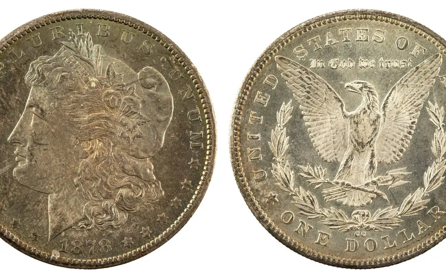 Coins and bullion bought in Boston — an 1878 Morgan silver dollar, obverse and reverse