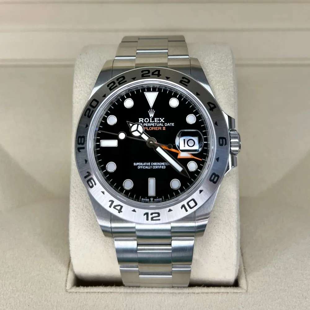 Rolex Explorer II with white polar dial and orange 24-hour hand — we buy Explorer IIs in Boston